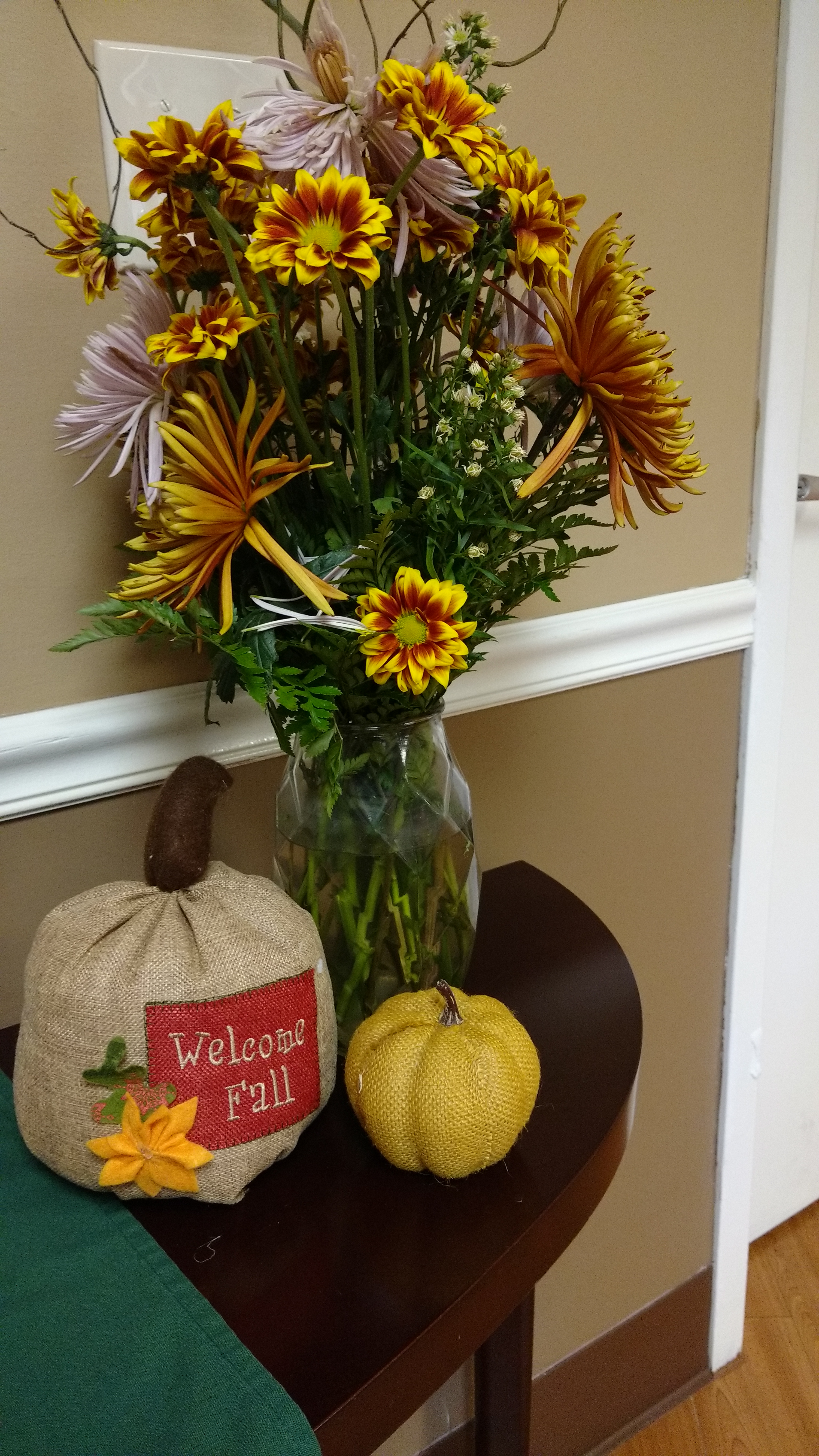 flowers in vase with Welcome fall pumpkin